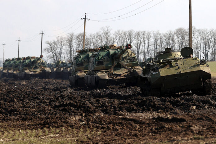 ROSTOV-ON-DON REGION, RUSSIA - FEBRUARY 22, 2022: Armoured vehicles move along. On February 21, Russia recognized the Do