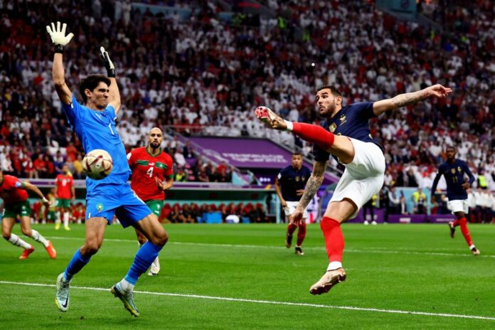 Al Khor, Qatar, 14th December 2022. Theo Hernandez of France scores the first goal past Yassine Bounou of Morocco during