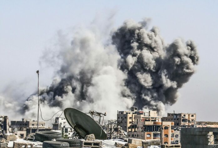 Smoke rises over residential buildings following an Israeli airstrike on the Tuffah neighborhood in the eastern part of Gaza City