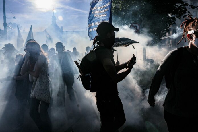 Police Fire Tear Gas During Geneva Protest