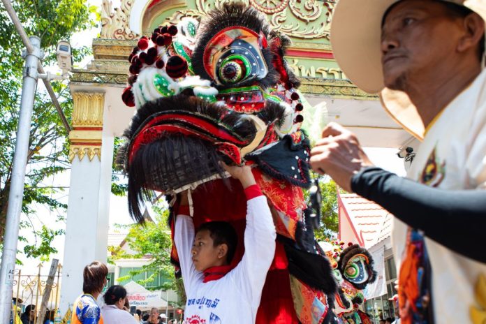Dragon dance performances in local communities in Bangkok.
